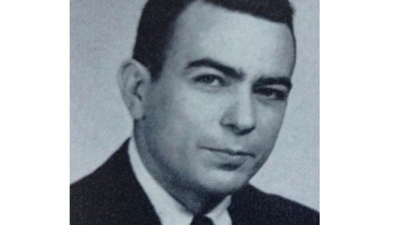 A 1961 yearbook photo portrait of Frank A. Palmerino